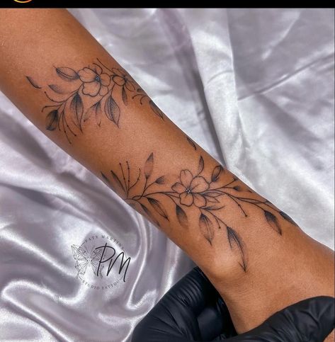 Wrapped Wrist Tattoo, Women Arm Tattoo Classy, Women’s Tatoos, Lily Wrist Tattoo, Wrap Around Flower Tattoo Arm, Wrist Wrap Tattoos For Women, Independence Tattoo, Dainty Sleeve Tattoos For Women, Flower Wrap Around Tattoo