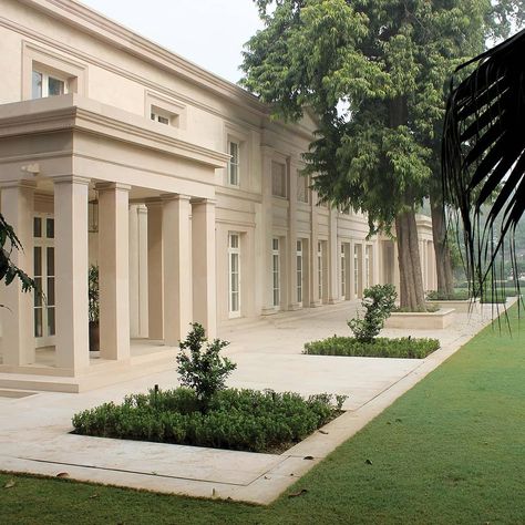 A modern classical villa in the heart of New Delhi, India, inspired by simple classical buildings of the Regency period, combined with Indian materials and traditions, sitting comfortably alongside the historic buildings nearby. Designed by @geosaumarezsmith with interior designer @kellingdesigns #classicalarchitect #classicalarchitecture #classicalcountryhouse #regencyinspiredhouse #localbuildingmaterials #localvernaculararchitecture #classicism #classicalhouse #newdelhi #india #adamarchitectur Modern Classical House, Neoclassical Facade, Delhi House, Georgian House Plans, Adam Architecture, Indian House Exterior, Classic Villa Design, Classic Houses, Indian House Exterior Design