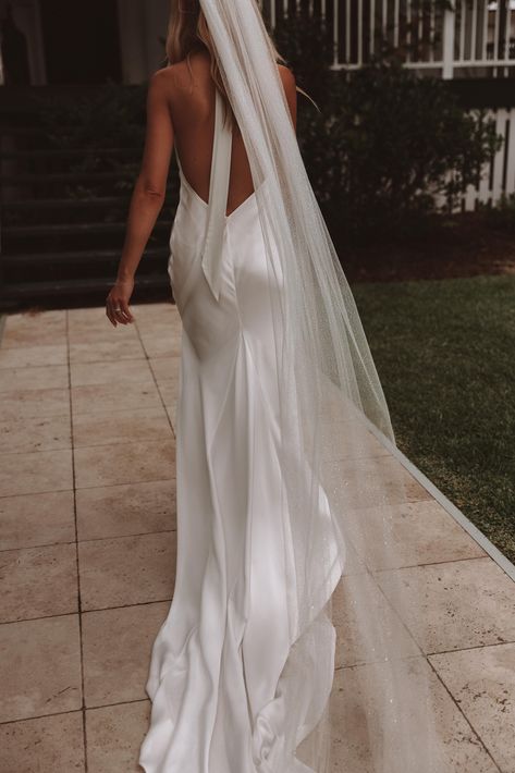 Meet Goldie, our modern and effortlessly chic double-layer wedding gown. Featuring an open back and high neck, she is striking to say the least. Part of our Memoirs of Her collection she is Ready-to-wear, Ready-to-wed – try her on in GRACE showrooms now with our shimmy veil too. #GRACELOVESLACE #GRACEBride #Memoirsofher #Weddinggown #Bridalstyle #23bridaltrends #Satinweddinggown #Weddingdress #Highneck #Openback #shimmyveil #Sparklyveil #glitterveil Simple Silk Wedding Dress, Mermaid Wedding Dress Satin, Simple Mermaid Wedding Dress, High Neck Wedding Gown, Backless Wedding Dresses, Wedding Dress Satin, High Neck Wedding Dress, Neck Wedding Dress, Shot List