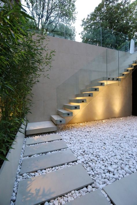 This beautiful North London home features over 200 pieces of bespoke concrete in an original, custom-made colour, creating a space that is as unique as it is refined and sophisticated. Our concrete tiles were brilliantly utilised inside, outside, and on the walls to create a beautiful, cohesive space. Build: William Carter Ltd Architects: LBMV Architects Tiles: Lazenby Contracts Ltd Exterior Staircase Design Outdoor, Stairs Outdoor Design, Staircase Design Modern Outdoor, External Staircase Covering Ideas, House Features Unique, Exterior Concrete Stairs, Stairs Exterior, Outdoor Stair Design, Stairs Outside