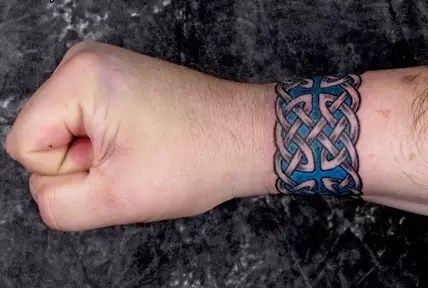 What Meanings Do Celtic Tattoos Have? An Illustrated Guide Celtic Armband Tattoo, Wrist Tattoo Design, Celtic Band Tattoo, Symbolism Tattoo, Armband Tattoo Meaning, Celtic Sleeve Tattoos, Rope Tattoo, Tattoo Celtic, Celtic Tattoos For Men