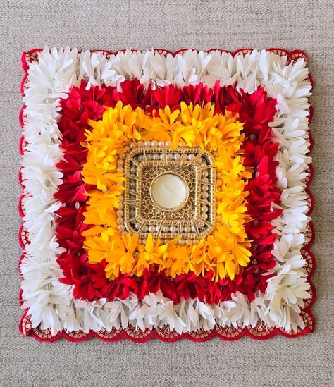 Colorful Square Rangoli mat with traditional gajra and candle Base mdf Size 12.5 x 12.5 inch Packaging - plastic bag DM us for more details or Whatsapp us on 9867422790 Square Flower Rangoli, Square Rangoli Design For Diwali, Rangoli With Diyas, Square Rangoli Design, Square Rangoli, Bappa Decoration, Diwali Crafts, Simple Flower Rangoli, Diya Decoration