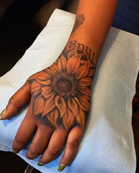 Gorgeous Sunflower #handtattoo With Text #sunflowertattoo #sunflowertattoomeaning Sunflower Hand Tattoo, Sunflower Tattoo Meaning, Hand Tattoo Images, Ring Finger Tattoos, Vine Tattoos, Sunflower Tattoos, Hand Tattoos For Women, Make Tattoo, Sunflower Tattoo Design