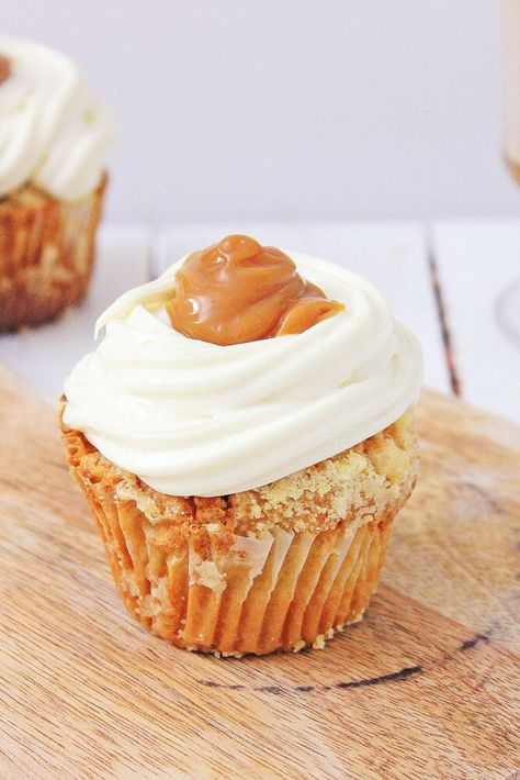 "These Hot Buttered Rum Cupcakes are sure to bring a taste of this classic cocktail to any celebration. Tender cupcakes topped with sweet rum frosting, and a buttery caramel sauce give these amazing cupcakes their sweet taste. These cupcakes are a great way to give your holiday baking an extra special touch. Plus, the rum frosting is light and fluffy, while the buttery caramel sauce adds a rich flavor that ties everything together. And they are perfect for any occasion, these Hot Buttered Rum Rum Frosting, Rum Cupcakes, Oreo Ball, Cauldron Cake, Boozy Cupcakes, Amazing Cupcakes, Moist Cupcakes, Buttered Rum, Best New Recipes