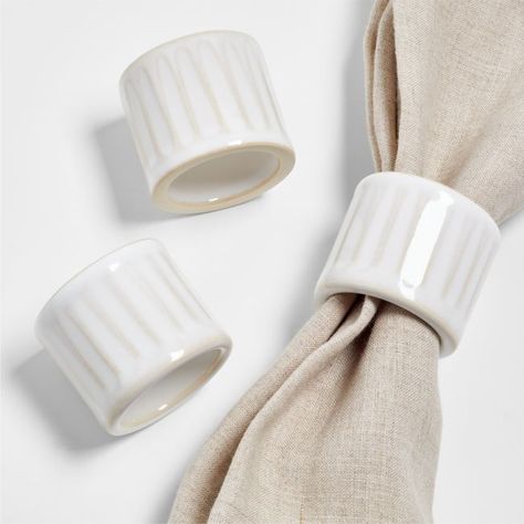 Our Dover napkin ring encircles your favorite dinner napkin with the look of handcrafted ceramics. Made of ceramic and decorated with vertical indentations to match our Dover dinnerware, the ring is washed with a filmy white glaze that pools in the crevices. Unglazed ends enhance its artisanal-like appeal.View all Dover Dinnerware   • Glazed ceramic  • Dishwasher-safe  • Imported Dover White Stoneware Napkin Ring Ceramic Wedding Gift, Ceramic Napkin Rings, Gold Napkin Rings, Upholstered Banquette, Napkin Rings Diy, Dover White, White Dinner Plates, Diy Ceramic, Old Fashioned Glass