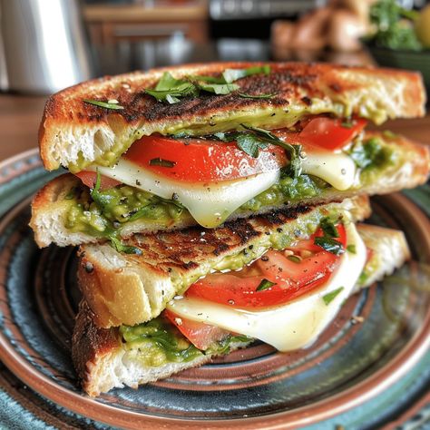 Savor the flavors of an Avocado, Mozzarella, and Tomato Grilled Cheese. Perfectly crispy and deliciously cheesy in every bite. Tomato And Avocado Sandwich, Avocado Cheese Sandwich, Pesto Tomato Mozzarella Sandwich, Grilled Mozzarella Sandwiches, Grilled Cheese With Avocado, Tomato Mozzarella Sandwich, Mozzarella Grilled Cheese, Tomato Grilled Cheese, Avocado Grilled Cheese