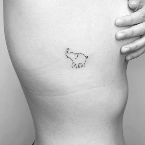 Minimalistic style elephant tattoo done in fine line. Joshua Tattoo, Community Tattoo, Simple Elephant Tattoo, Tiny Elephant Tattoo, International Tattoo, Africa Tattoos, Thailand Tattoo, Elephant Tattoo Design, Handpoke Tattoo