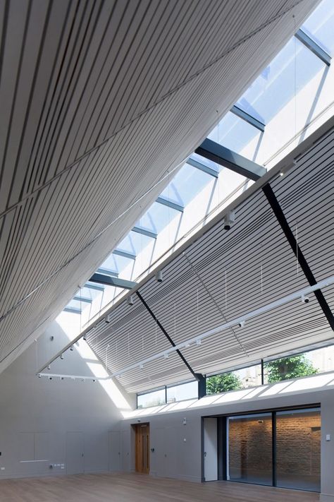 Medieval church hall renovation features light-filled extension and glazed walkway Glazed Walkway, Medieval Church, Skylight Design, Wayfinding Signage Design, Multipurpose Hall, Apex Roof, Cotswolds England, Community Halls, Community Centre