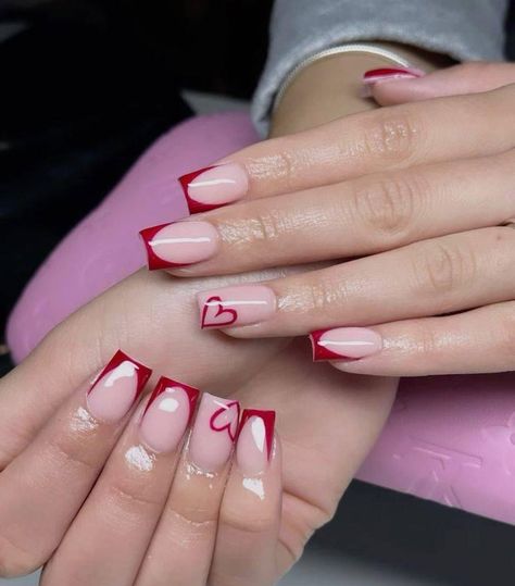 Nail Inspo Square Valentines, Dark Red French Tip Nails With Heart, Red Nails Acrylic Ideas, Matte Red French Tip Nails, French Tip With Heart On Ring Finger, Valentine’s Day Nails Square, Red French Tip With Heart, Nail Ideas With Red, St Valentin Nails