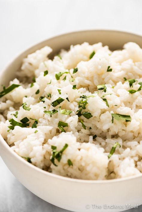 PIN TO SAVE! Coconut rice is so easy to make and the perfect side dish to all your Asian-influenced recipes. This recipe is a sugar-free version of your favorite Thai restaurant rice. #theendlessmeal #coconutrice #rice #coconut #thaicoconutrice #thairice #thai #coconutmilkrice #jasminerice #sugarfree #sidedish #vegan #vegetarian #glutenfree #grains #ricerecipe Thai Cuisine Recipes, Chipotle Cilantro Lime Rice, Thai Coconut Rice, Garlic Ginger Chicken, Mango Chicken Curry, Pineapple Pork Chops, Easy Risotto, Risotto Recipes Easy, Rice Coconut