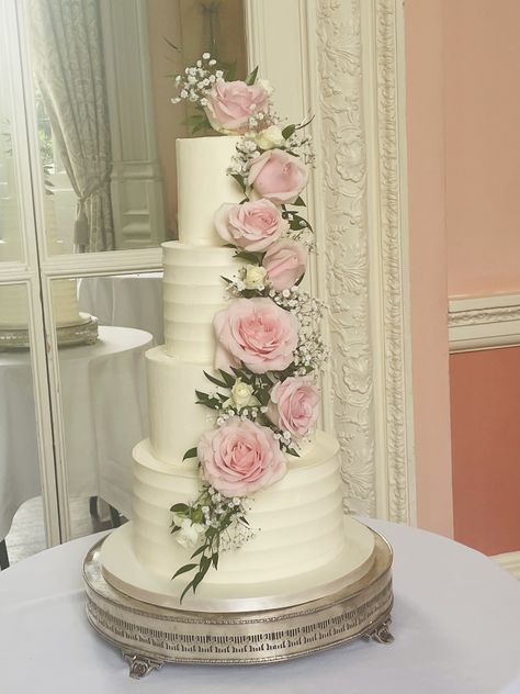 4 tier buttercream frosted cake in the ever popular Nature's Charm wedding cake with a cascade of fresh roses, ruscus and gypsophilia Frosted Cake, Tiered Cake Design, Buttercream Roses, Wedding Cake Roses, Buttercream Wedding Cake, Wedding Party Ideas, Wedding Cake Inspiration, Cake Inspo, Wedding Cake Designs