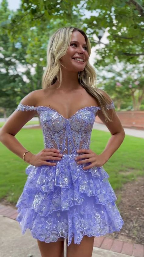 Elegant women's a-line off-the-shoulder lace homecoming dress with tiered skirt Lilac Prom Dresses Short, Hoco Dresses Flowy Purple, Lilac Purple Hoco Dress, Sweet Sixteen Court Dresses, Unique Short Prom Dresses, Hoco Dresses Butterfly, Hoco Dresses Fairytale, Wizard Of Oz Hoco Theme Dress, Hoco Dresses 2024 Flowy