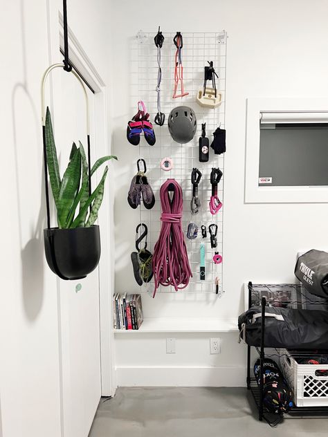 Climbing gear grid-wall organization system Surf Gear Storage, Hiking Gear Peg Board, Gym Gear Organization, Diy Gear Wall, Climbing Gear Aesthetic, Climbing Equipment Storage, Gear Storage Wall, Climbing Gear Wall, Climbing Organization