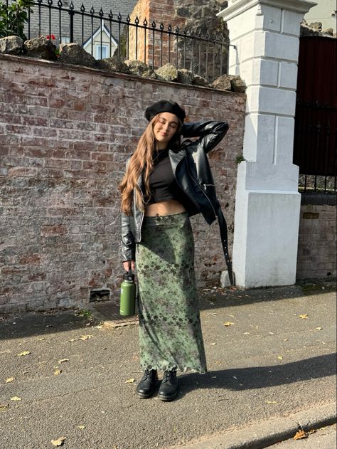 Floral green maxi skirt, black leather biker jacket, dr marten boots, black beret Maxi Skirt With Leather Jacket, Long Floral Skirt Outfit Winter, Floral Skirt Fall Outfit, Floral Doc Martens Outfit, Dr Marten Boots Outfits, Dr Marten Chelsea Boots Outfit, Green Floral Skirt Outfit, Maxi Skirt With Boots, Black Beret Outfit