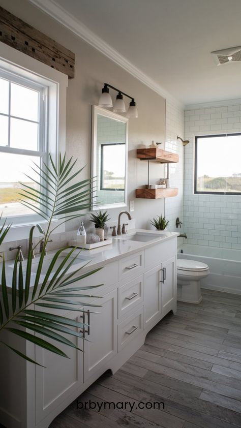 Check out these 46 Coastal Bathroom Ideas. Transforming your bathroom into a coastal-inspired space can make it feel like a retreat, bringing in the easy, breezy vibes of the seaside. Whether you live near the coast or just love the relaxed style, Queenslander Bathroom Renovation, Coastal Blue Bathroom, Coastal Modern Bathroom, Beach House Bathroom Ideas, Bathroom Beach Theme, Stone Shower Floor, Coastal Bathroom Ideas, Spare Bathroom, Beach House Bathroom