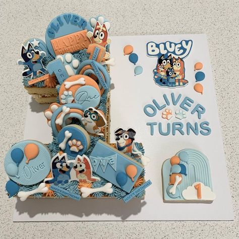 Susan Rowett on Instagram: “A very cute Bluey theme to celebrate Oliver turning 1 😍” Diy Number 2 Cake, Number 1 Bluey Cake, Bluey Cupcake Pull Apart, Number Cake Bluey, Bluey Pull Apart Cupcakes, Bluey Number Cake, Bluey 1st Birthday Cake, Number 1 Birthday Cake Boy, Number 1 Cake