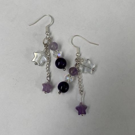 Amethyst and Crystal Star Dangle Earrings | Purple Star Earrings | Cute Accessory A cute pair of amethyst star dangle earrings for any occasion! Includes two earrings in a pair made just for you! Gift it to a friend or keep it for yourself. Perfect for the hard to gift for friend. :D Length : 2.5 inches  Make time : Will be made and shipped out within 1 - 3 days  Contact us with any issues and we will guarantee to make it right.  Handmade item by Audrey and Ruby from BugsandSlugsShop. Colors may vary slightly due to photo lighting. Check out our other products at BugsandSlugsShop and follow our instagram @bugsandslugsshop to keep updated on new listings and sales ! Purple Star Earrings, Star Bead Earrings, Purple Earrings Aesthetic, Whimsigoth Earrings, Bead Things, Purple Dangle Earrings, Star Dangle Earrings, Keychain Ideas, Beading Jewelery