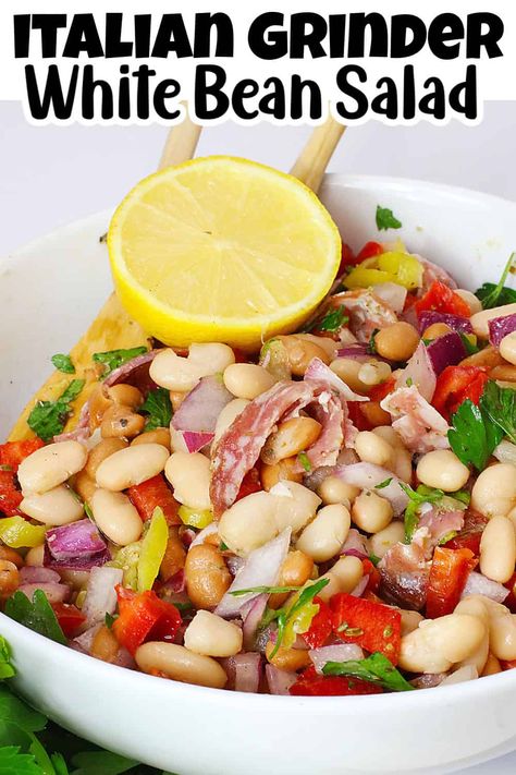 Try our mouthwatering white bean salad with salami and pepperoncini peppers - the ultimate side dish for every gathering. This no-bake recipe celebrates the iconic grinder sandwich flavors, using fresh Italian ingredients. Plus, it's gluten and dairy-free, making it a versatile option for any event. Italian White Bean Salad, Italian Grinder Bean Salad, Grinder Bean Salad, Bean Salad Italian, White Bean Salad Recipes, Italian Grinder, Grinder Sandwich, Bean Salad Recipe, Pepperoncini Peppers