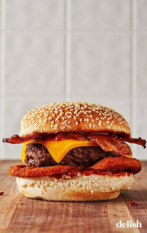 The Western Bacon Cheeseburger holds a special place in our hearts. It’s hard not to love a bacon cheeseburger, but when you add tangy BBQ sauce and crispy onion rings to the mix, then you are on your way to burger heaven. Western Bacon Cheeseburger, Carls Jr, Crispy Onion Rings, Homemade Onion Rings, Carl's Jr, Tangy Bbq Sauce, Best Fast Food, Fast Food Menu, Bacon Burger