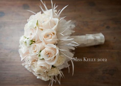 I was IN LOVE with my bouquet! Ivory rose bouquet with swarovski crystal and ostrich feathers! #bride #bridal #bouquet #roses #white #ostrich #wedding #feather #diamonds #swarovski Ivory Rose Bouquet, Trailing Bouquet, Feathers Wedding, Feather Bouquet, Wedding Party Flowers, Great Gatsby Wedding, Vintage Bouquet, Feather Wedding, Prom Flowers