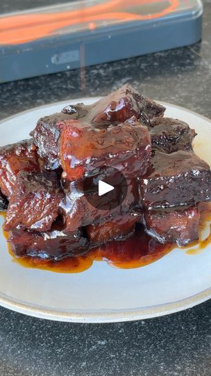 279K views · 4.8K reactions | Poor man’s burnt ends | If you have brisket taste but on a hotdog budget try these poor man’s burnt ends! So saucy and delicious! #burntends #bbq | By Ninjacue | If you have brisket taste but a
hotdog budget, these poor man's burnt ends are just for you.
These are smoked low and slow until they're super tender and
delicious. You're going to take a chuck roast. Cover it with
some olive oil as a binder. Season it with your favorite
barbecue rub and get your smoker fired up. Got some pecan
wood here. Indirect 2 fifty degrees for about four to six
hours until it reaches a hundred and seventy-five
degrees. You can see the bark is set and that color is
looking right. You're going to chop this up into cubes one by
one 2 by 2, whatever you want to do. Add some butter, Poor Man's Burnt Ends, Barbecue Rub, Braised Short Ribs Recipe, Honey Barbecue Sauce, Traeger Grill Recipes, Honey Barbecue, Short Ribs Recipe, Burnt Ends, Pecan Wood