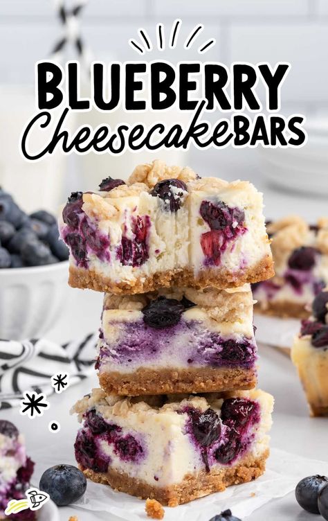 a close up shot of Blueberry Cheesecake Bars stacked on top of each other with one having a bite taken off Blueberry Cheesecake Bites, Bluberry Muffins, Holiday Deserts, Blueberry Crumb Bars, Cheesecake Bar, Bakers Delight, Blueberry Cheesecake Bars, Blueberry Bars, Bar Desserts