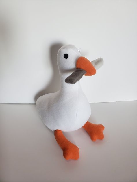 Hello, and thank you for viewing this item! This plush is made in the image of the Untitled Goose Game. Here are a few things about the product you may want to know: 1. Each individual plush is handmade special by me and takes up to 1-2 weeks to complete the plush after it is completed the plush will be shipped. The shipping I usually use is first-class 2-5 business days. If you would like the shipping to be sooner please message me about additional shipping rates. 2. The plush is made with flee Goose With Knife, Goose Plush, Untitled Goose Game, Goose Game, Walpapers Cute, Duck Wallpaper, Funny Duck, Cute Stuffed Animals, Pigs