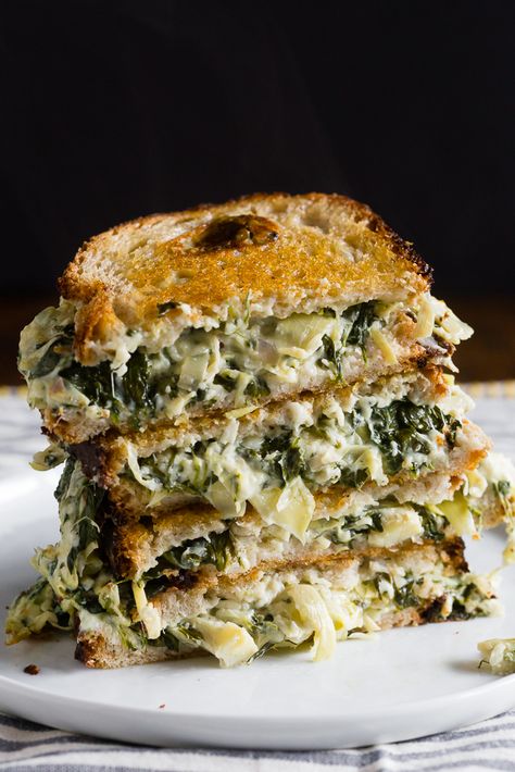 Spinach & Artichoke Grilled Cheese recipe - Inspired by the classic dip, with spinach, artichoke hearts, and three cheeses. The ultimate adult grilled cheese! Artichoke Grilled Cheese, Artichoke Grilled, Grilled Cheese Recipe, Artichoke Recipes, Grilled Cheese Recipes, Artichoke Hearts, Spinach Artichoke, Spinach And Cheese, Cheese Recipe