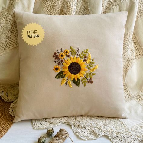 Digital download embroidery pattern with sunflower motifs for a cushion cover. Decorative embroidered linen pillow case with a sunflower pattern will make any room cozier, especially bedroom or living room. The embroidery design measures 12.5 x 13 cm. Pillowcase size 38x38cm (15 x 15 inches). This statement floral pattern is intended for those who already have a basic understanding of embroidery stitches and techniques but suitable for anyone who is new to embroidery, because it includes a step-by-step 16-page tutorial with many photos! All the stitches used here are beginner-friendly! This cushion cover PDF pattern uses 6 colors of DMC thread. Your purchase includes: - A printable pattern. The design measures 12.5 x 13 cm - A color guide with codes for the 6 DMC threads and stitches I use Embroidery Basic Design, Embroidery Pillowcases Patterns, Sunflower Embroidery Designs, Sunflower Embroidery Pattern Design, Pillow Cover Embroidery Designs, Embroidery Sunflower Pattern, Embroidery Designs Sunflower, Sunflower Embroidery Pattern, Pillow Embroidery Designs