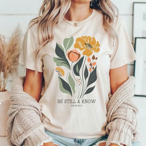 #bestillandknow #christianshirts Christian Flowers, Scripture Shirt, Christian Shirts Designs, Church Shirt, Bible Verse Shirt, Be Still And Know, Jesus Shirt, Floral Graphic, Christian Apparel