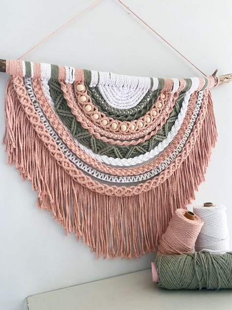 Light pink, sage and white boho inspired semi-circle wall hanging on driftwood. 100% recycled cotton cord. #macrame #bohostyle #nurserydecor