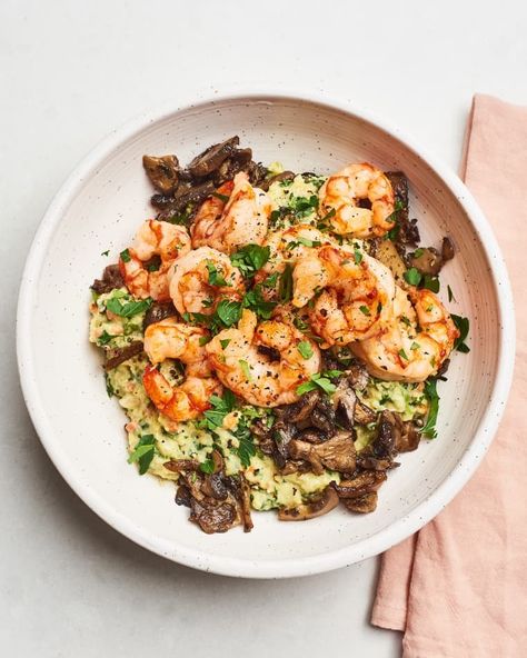 This easy dinner makes use of some of the best items to stock up on at Trader Joe’s. Frozen shrimp is always a smart thing to have on hand, because it’s versatile and cooks up fast. Here, you don’t even need to bother defrosting it. Simply roast it on a hot sheet pan with some frozen mushrooms, and in about 10 minutes dinner is done. Defrost and heat the polenta while the shrimp and veggies cook, so you can immediately pile the mix on top and dig right in. Seafood Mix Recipes Frozen, Polenta Shrimp, Seafood Mix Recipes, Shrimp And Polenta, Shrimp Bowl, Seafood Mix, Joe Recipe, Trader Joes Recipes, Creamy Polenta