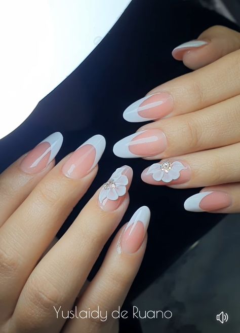 Nail design for wedding, consisting of white nail polish at the tip of the nail in oval shape. On the ring finger is a white flower of five petals with rhinestones on the center of the flower Classy Nail, Nails Inspired, Pink Glitter Nails, Classy Nail Designs, Flower Nail, Bride Nails, 2024 Wedding, Uñas Acrilicas, Bridal Nails