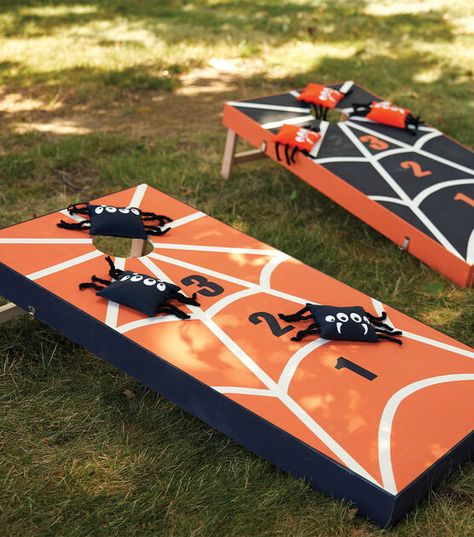 Fall Cornhole Boards, Bean Bag Toss Halloween, Corn Hole Halloween Game, Halloween Cornhole Diy, Halloween Bazaar Ideas, Halloween Bean Bag Toss Game, Halloween Corn Hole Boards, Halloween Cornhole Boards, Halloween Game Booth Ideas