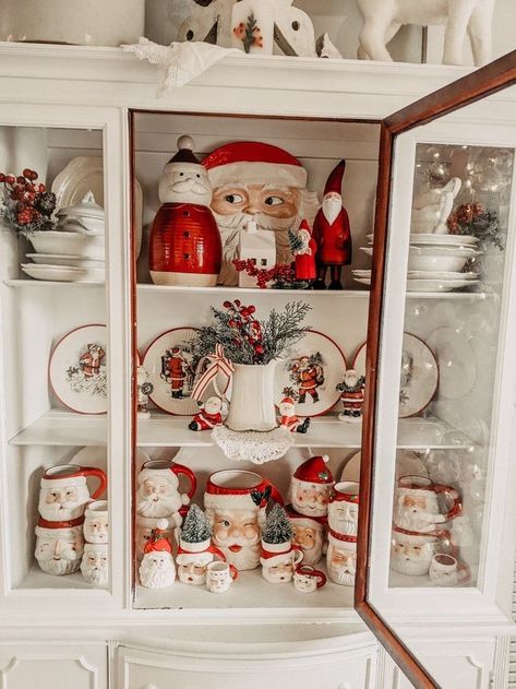 Vintage Santa Mug Display, China Cabinet Christmas Display, Kitchen Shelf Christmas Decor, Kitchen Counter Christmas Decor, Christmas Hutch Decor, Vintage Christmas Ideas, Christmas Hutch, Christmas Shelf, Santa Cups