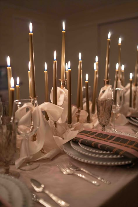 Bows and pearls-themed birthday table setting! Adorned in olive green and pink hues, this setup is perfect for 2024 trends. With bows tied around candles as the centerpiece. Custom plaid napkins add a personalized touch, while velvet linens and vintage silverware elevate the ambiance. Don't miss the pearled edge plates at every place setting. Overflowing with bows, this table setting is the epitome of timeless style. Celebrate in luxury and charm with our meticulously curated birthday setup! Birthday Table Setting, Birthday Setup, Unique Wedding Table Decorations, Unique Wedding Stationery, Plaid Napkins, Green Centerpieces, Reception Table Decorations, Candle Wedding Decor, Romantic Wedding Inspiration