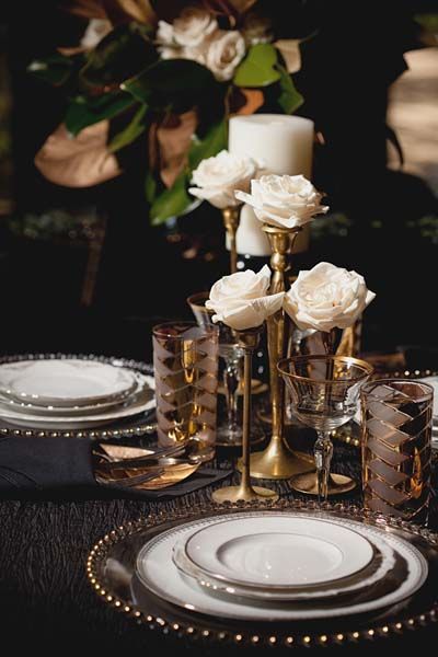 I have a bunch of brass candlesticks exactly like these.  Topping them with flowers is a great idea, especially if your venue doesn't allow open flames. Art Deco Wedding Centerpieces, Art Deco Wedding Inspiration, Hollywood Glam Wedding, Old Hollywood Wedding, Great Gatsby Wedding, Hollywood Wedding, Old Hollywood Glam, Gatsby Wedding, Art Deco Table