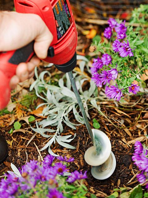 A garden auger takes the backache out of planting by digging holes for you. Most bulb-size models attach to a household drill, while larger power augers are available for planting trees and shrubs.                         Test Garden Tip: Drill-attachment models are best used with corded drills. If your drill is battery-operated, be sure that it has at least 18 volts of power. Digging Holes, Planting Calendar, Planting Trees, Yard Tools, Garden Wallpaper, Plant Tags, Home Vegetable Garden, Gardening Gloves, Small Space Gardening