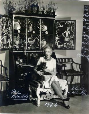 Elsie de Wolfe, aka Lady Mendel, posing in front of Tony Duquette's famous “Elsie de Wolfe Cabinet” which he designed for her in 1941. Tony Duquette, Modern Chinoiserie, Elsie De Wolfe, Cafe Society, Big Star, Little Dogs, Tv Stars, White Paints, Pet Shop