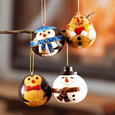 Mate or calabash gourd is used in Peru for creating decorative and utilitarian objects since pre-Hispanic times. Artisan Blanca Canto handcrafts and hand-paints this cute set of four ornaments with dried calabash gourd in the shapes of penguins and snowmen representative of the holiday season. | Novica 4 Piece Animal Hanging Figurine Ornament Set Wood in Blue / Brown / Orange, Size 2.4 H x 2.4 W x 2.4 D in | Wayfair Small Gourd Ornaments, Gourd Christmas Ornaments, Utilitarian Objects, Pottery Templates, Snowman Gourds, Bead People, Gourd Ornaments, Calabash Gourd, Hand Painted Gourds