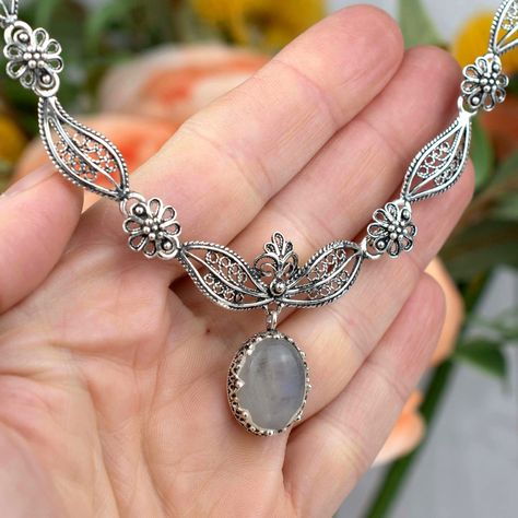 ✨ Adorn your neckline with the mystique of the moon! Our Gray Moonstone Sterling Silver Pendant is not just a piece of jewelry—it's a wearable piece of fine art. Dainty filigree work encases the enchanting gem, creating a masterpiece fit for a princess. Whether you're treating yourself or searching for a captivating gift, this charm is a treasure to cherish. ✨ Dive into the world of elegance: 👉 [https://nuel.ink/ztQ0iR #MoonstoneMagic #ElegantJewelry #GiftHer #GemstoneGlow #SilverSophistica... Grey Moonstone, Princess Necklace, Filigree Necklaces, Filigree Jewelry, Sterling Silver Filigree, Paisley Design, Girls Necklaces, Silver Filigree, Elegant Jewelry