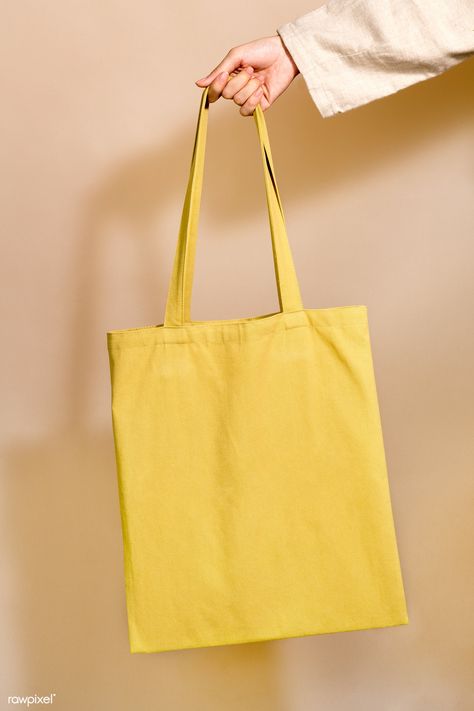 Woman holding a yellow tote bag in her hand | free image by rawpixel.com / Jira Blank Tote Bag, Diy Clothes Bag, Yellow Tote Bag, Cotton Shopping Bags, Photo Woman, Eco Bags, Eco Tote Bag, White Tote Bag, Bag Mockup