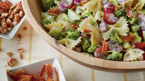 Easy & Delicious Broccoli, Grape, and Pasta Salad | Recipe: Broccoli, Grape, and Pasta Salad If you're a broccoli salad fan, you'll love the combination of these colorful ingredients. This simple and over-the-top tasty salad is one of our most popular pasta salad recipes. Serve this dish as a springtime side alongside your favorite grilled chicken recipe, or double the batch to share at a potluck or church gathering. Everyone will be asking for the recipe! Harvest Salad Recipes, Salad Coleslaw, Broccoli Pasta Salads, Easy Broccoli Salad, Salad Kale, Resep Pasta, Resep Salad, Harvest Salad, Best Pasta Salad