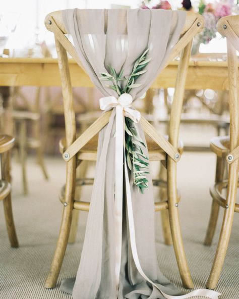 Looking for a way to upgrade your reception chairs? Make like The Nouveau Romantics and tie a cloth to the back of each seat with a satin ribbon. Add a bit of greenery for a hint of color. #Wedding #Ribbon #WeddingDecor #Chairs #ChairDecorations #WeddingReception #Unique #Weddings #RibbonDecor | Martha Stewart Weddings - 30 Ribbon Wedding Ideas for Every Type of Celebration Eucalyptus Wedding Decor, Wedding Chair Sashes, Ceremony Chairs, Wedding Chair Decorations, Reception Chair, Eucalyptus Wedding, Bridal Musings, Gray Weddings, Mod Wedding