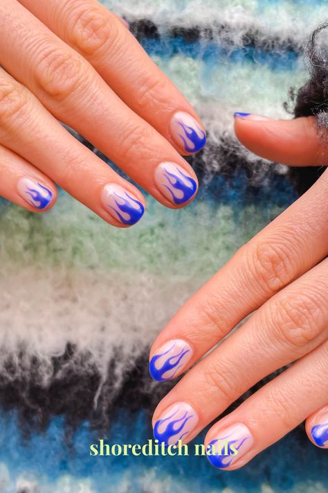 Vibrant blue flames are the essential winter accessory, great if you want a December mani that isn't traditional Short Nails Flame Design, Blue Detail Nails, Red And Blue Flame Nails, Nail Art Flames, Blue Flame Nails Short, Pink And Blue Flame Nails, Dark Blue Flame Nails, Blue Flame Nails, Flames Nail Art