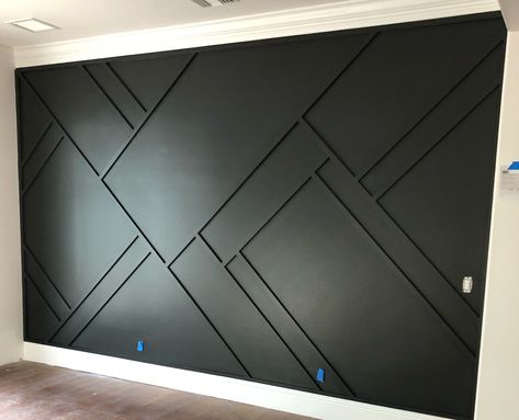 Mens Office Accent Wall, Black Geometric Wall, Accent Wall Mens Bedroom, Geometric Accent Wall Living Room, Black Wall With Wood Accents, Black Geometric Accent Wall, Black Accent Wall Bedroom Led Lights, Men’s Bedroom Accent Wall, Dark Grey Accent Wall Bedroom