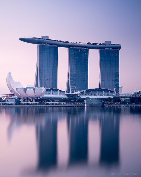 Singapore Dawn: Moshe Safdie's  Marina Bay Sands looks almost neolithic in certain lights. Marina Bay Sands Singapore Photography, Safdie Architects, City Paintings, Moshe Safdie, Singapore Attractions, Marina Bay Sands Singapore, Singapore Trip, Singapore Architecture, Sands Singapore