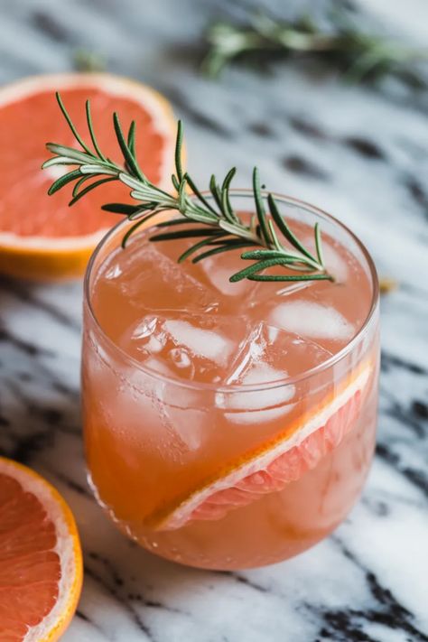 A photo of a  Grapefruit Rosemary Mocktail a Mocktail Recipes for Dry January Grapefruit Mocktail Recipe, Rosemary Mocktail, Grapefruit Mocktail, Pomegranate Mocktail, Best Mocktail, Easy Mocktail Recipes, Alcohol Free Drinks, Mocktail Recipes, Dry January