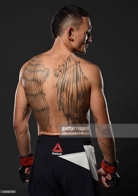 Max Holloway poses for a portrait backstage after his victory over Charles Oliveira during the UFC event at the SaskTel Centre on August 23, 2015 in Saskatoon, Saskatchewan, Canada. Max Holloway Tattoo, Max Holloway, Charles Oliveira, Saskatoon Saskatchewan, Saskatchewan Canada, Sports Poster, Sport Poster, Ufc, High Res