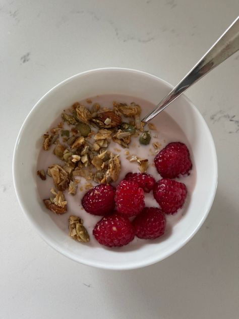 Pink Greek yogurt, fresh raspberries, granola, and honey inside of a white bowl on a white marble countertop Granola And Yogurt Breakfast, Granola With Yogurt Breakfast Ideas, Yogurt With Granola, Gain Meals, Raspberry Granola, Greek Yogurt With Berries And Granola, Yogurt And Granola Aesthetic, Weight Gain Meals, Yogurt And Granola